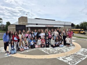 A large group of seventh and eighth grade students and chaperones pose for a group photo outside Cleveland Clinic Union Hospital during the Middle School Career Connections program